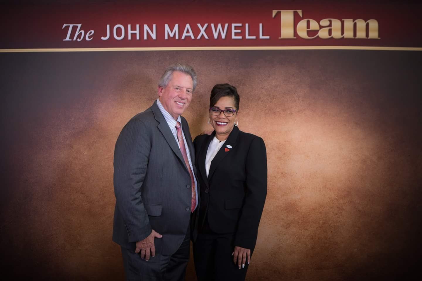 Dr. Crystal Davis with John C Maxwell