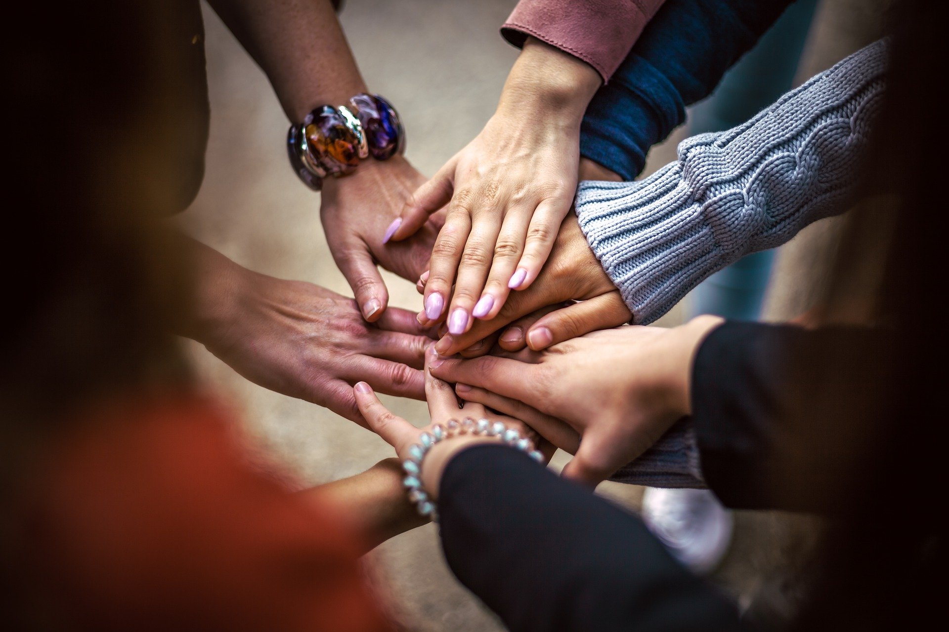 Group of People Joining Hands